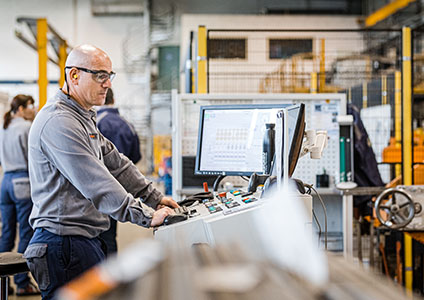 Operator at the control table of the Kocks rolling mill